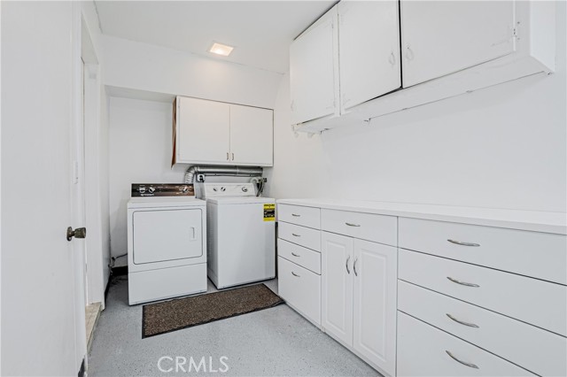 Laundry area next to garage