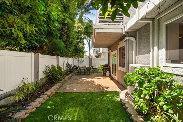 Backyard is landscaped and private