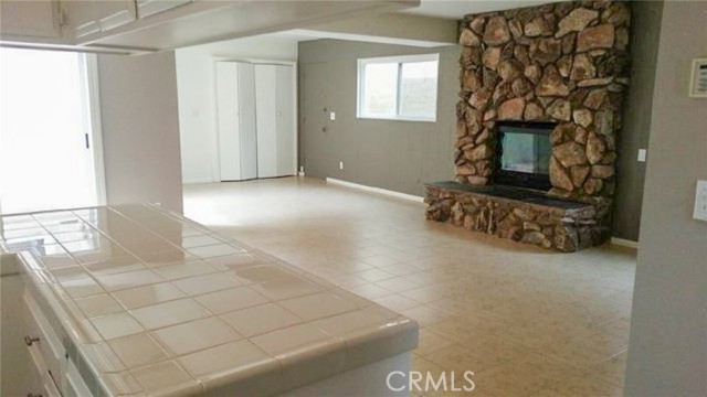 This is from the kitchen entry back through the family room.  The doors in the center of the back are the laundry area for the front unit