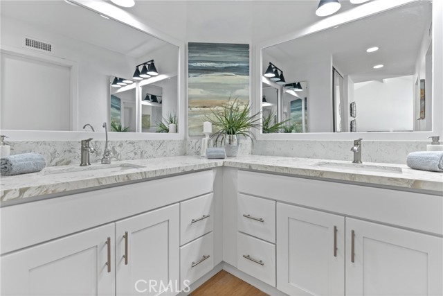 Nicely upgraded Master Bathroom with dual sinks and new light fixtures