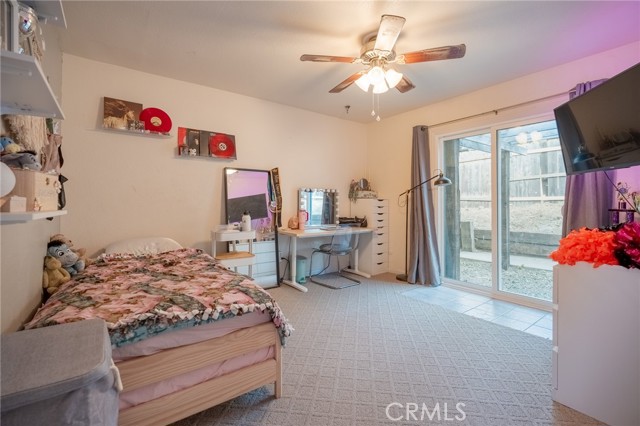 BEDROOM #2 WITH CIELING LIGHT AND FAN AND NEW SLIDER ACCESS TO OUTSIDE PATIOS