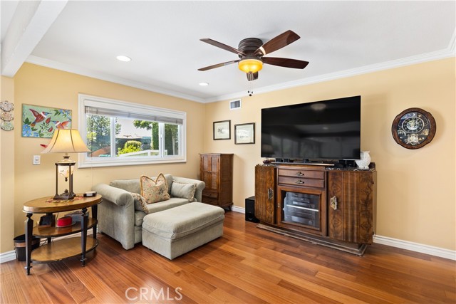 Open floor plan concept for kitchen, family room, and third area with Brazilian hardwood flooring.