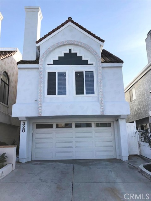 Exterior of home. New Garage Doors. Two car garage and Driveway for two cars.