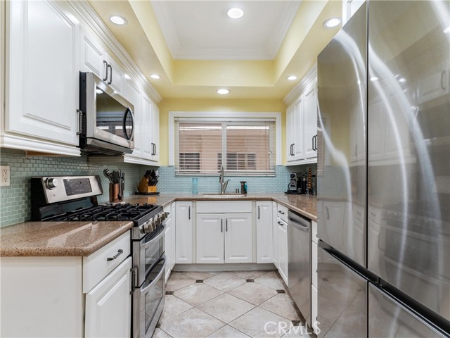 Remodeled kitchen, stainless steel appliances, updated and well maintained cabinets.