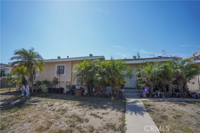 Nice 4 bedroom home with a large Family room with fireplace (495 sqft, per seller). Dual Pained windows, Covered Patio, Large backyard with fruit trees and RV parking. Close to shopping, Schools and Knott's Berry Farm.