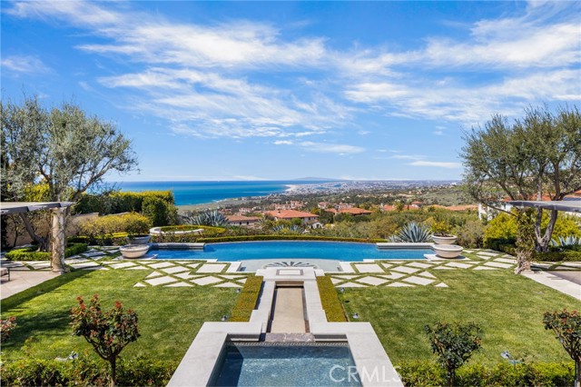 Located within the custom gates of Newport Coast’s premiere private community, Crystal Cove this estate offers timeless elegance and seclusion nestled on one of the largest custom parcels showcasing the most view frontages in the community. The panoramic views of the great pacific, white water crashing against the California coastline up to Palos Verdes, twinkling lights of Newport Harbor and year round sunsets with Catalina resting in the backdrop create a natural work of art that only accentuates the value and rarity of this property. Resting atop the gracious 28,000 sqft lot the approximately 15,000 sqft estate offers 7 bedroom suites and 12 stone clad bathrooms. No attention to detail or quality was spared in the thoughtful construction of this estate. Finely developed and curated by renowned builder, Rick Henricksen and designer Robert Ricker from the vision of master architect Richard Krantz, this property offers commercial grade construction and designer appointments fit for royalty. The calm coastal color pallet throughout evokes a sense of serenity for is inhabitants and guests that flow out to the expansive lush exterior grounds adorned with citrus groves, plumes of vibrant roses gardens, pool, water features, fire features, fine hardscapes and mature finely manicured landscapes. Offering every amenity one could dream of in a coastal retreat this home offers but is not limited to, Grand foyer and stairwell reminiscent of the finest hotels around the world, formal and informal living spaces, wood clad library, chefs kitchen, formal dining, multiple wine cellars, cinematic theater, gym, BBQ and exterior dining pavilion and covered heated decks and loggias throughout. The home is truly one of the finest Coastal California has to offer.