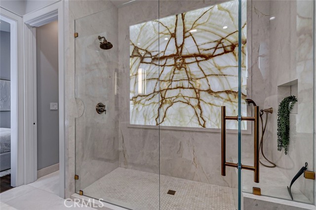 Primary Shower with Backlit Onyx Panel