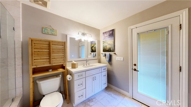 Bathroom off of kitchen with access to pool.  No need to drip through the house.