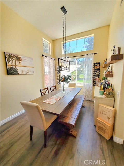 Formal dining area with vaulted ceiling and views of the golf course.