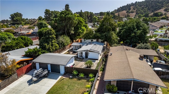 Aerial view of property with detached 2 car garage, primary home and ADU on 12,768 sq ft lot