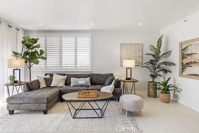 Living room with large sliders leading to patio