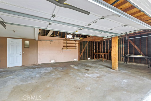 Check out this 3 Car Garage.  It's bigger in person than what you see here.  The access door leads to the backyard pool.