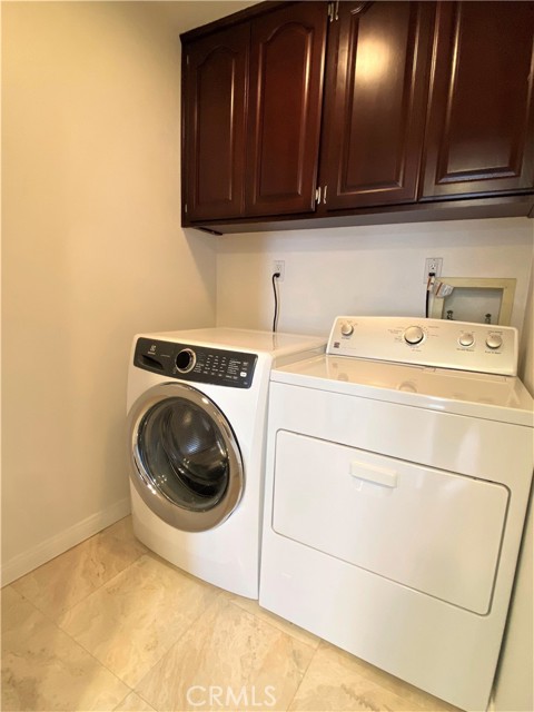 Laundry room with included appliances