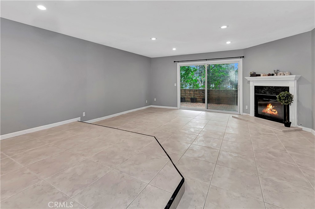 Introducing a beautifully renovated condominium located in Laguna Niguel! This residence is ideal for hosting gatherings with its impressive and open layout. The living and dining areas boast elegant tile flooring, and there's a cozy fireplace where you can unwind at the end of a tiring day. The patio is expansive, providing ample space for enjoying daylight-saving time dinners. The kitchen seamlessly connects to the living and dining spaces, creating a seamless flow. Both spacious bedrooms feature plush carpeting and high, exposed beam ceilings. The master bedroom, complete with an en-suite bathroom, offers direct access to the patio. Situated in the heart of Laguna Niguel, this home grants easy access to shopping, schools, parks, and golf courses, all just a short drive away. And the cherry on top: the beach is just a bike ride away!