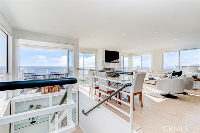 The stairwell features a striking built in display case or bookshelves.