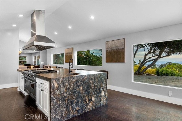 Huge island counter space and sub zero and Viking appliances.