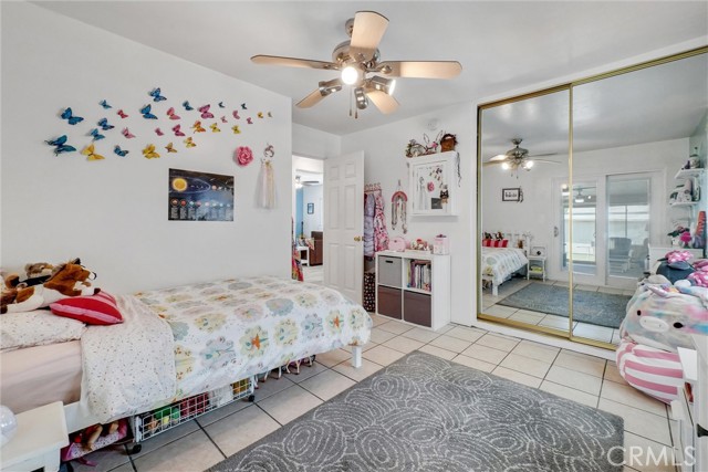 Bedroom 2. Upgraded Dual vinyl windows, plantation shutters, ceiling fan, mirrored closet doors