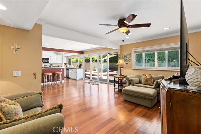 Open floor plan concept for kitchen, family room, and third area with Brazilian hardwood flooring.