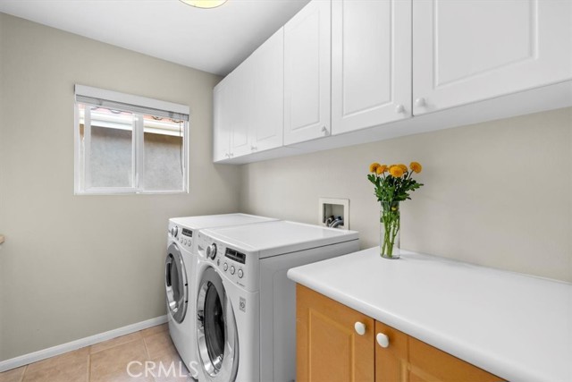 Convenient Upstairs Laundry w/ counter space and storage