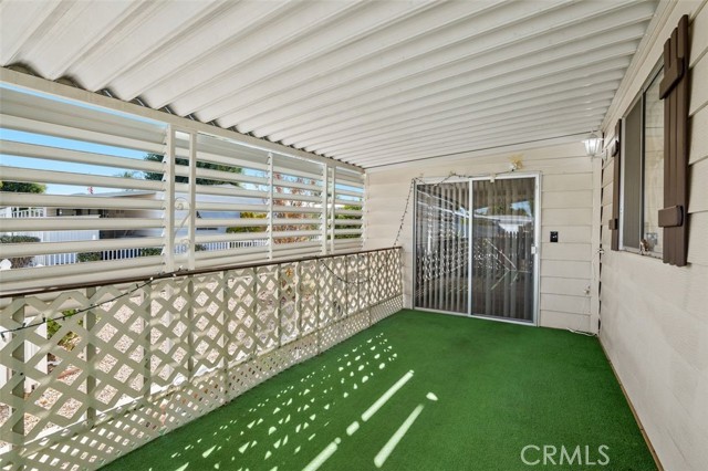 Shaded Porch with entry to the Living Room and Family Room