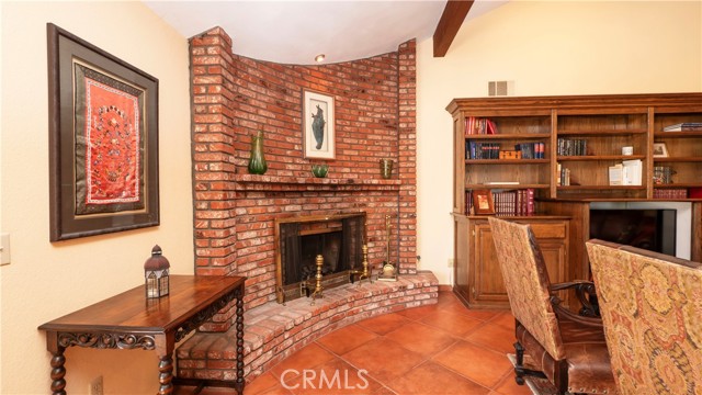 Dramatic fireplace and built in shelving