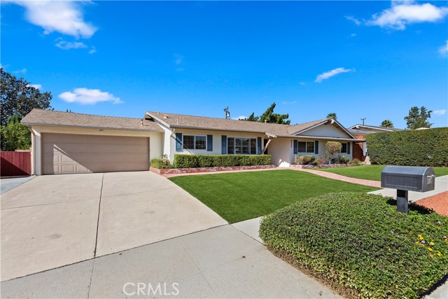 Front of Home - The geometric hedges surrounding the front yard add a touch of design elegance to the space.