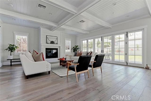 Family room with fireplace, coffered beamed ceiling