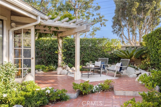 Relax on your private back patio surrounded by lush landscaping.