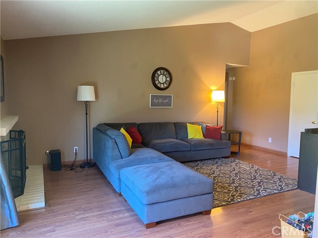 Vaulted ceilings enlarge this living room