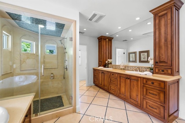 Beautiful Cabinets with Double Sinks and Large Shower.