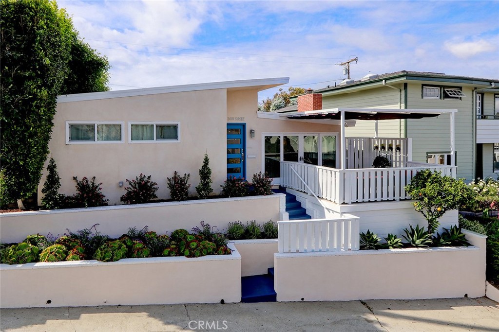 A classic and spacious beach home with style! Perfectly situated in the highly sought after 'Gaslight' district of the Manhattan Beach Sand Section, this beautiful ONE LEVEL Mid Century Modern single family home sits on a rare lot and a half (45' wide vs the standard 30').  Built for quiet family life AND entertaining, this four bedroom home lives much larger than the square footage. Included in the layout is a wonderful master suite with great bathroom and walk in closet. The extra width and its south-facing orientation gives the home plenty of natural light and a sneaky good view of the Tree Section and city lights below.. Standout features of this home are the large sunny private front deck off of the living room and spacious courtyard off the kitchen/family room that are perfect for outdoor dining and good times after a day at the beach. The 2 car garage opens through to a wonderful cul-de-sac like alley that allows for easy access to award winning Grandview Elementary School. Located just a few easy blocks from one of the most beautiful beaches in California and a short stroll to the shops and restaurants of famous downtown Manhattan Beach. You really CAN enjoy all of the benefits of both the Tree Section AND the Sand Section at 527 24th Street...You must see it to feel it!