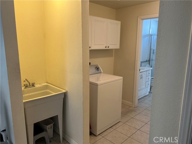 Laundry room and pantry/wash basin area