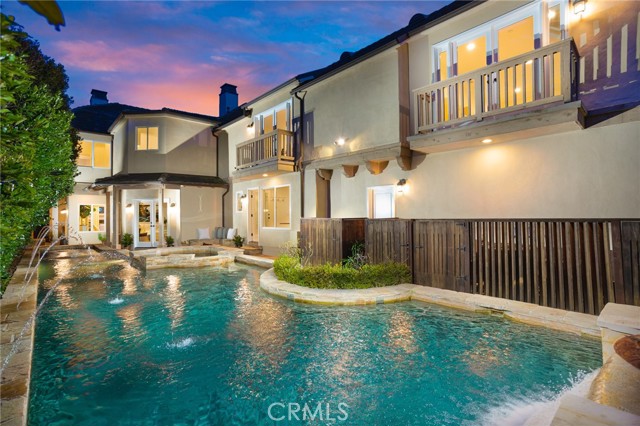 531 Fullerton Avenue Newport Beach, California Nestled within Newport Heights, this up-to-the-minute estate is a class of its own. Introduced by a gated pathway, the centerpiece of the approximately 5,174 square foot interior is a tall brick fireplace servicing the main living area and is one of three indoor fireplaces. Floors of walnut hardwood and travertine stone adorn the stellar living spaces which include a wine cellar, formal dining room, an expansive office area, and laundry room. The gourmet chef’s kitchen features countertops of Calacatta gold marble and Caesarstone Quartz and offers top-of-the-line appliances including Subzero and KitchenAid refrigerators, a Thermador professional range, dishwasher, and a new built-in espresso maker with Wifi capabilities. Other appointments include custom self-closing cabinetry/drawers, butler’s pantry, and a custom walnut butcher block. Two staircases lead upstairs to all four bedrooms including the owner's suite with grand beamed ceilings, a fireplace, spacious walk-in closet, marble countertops, and a soaking tub. Ideal for entertaining, the backyard hosts an appx. 50-foot lap pool with water features, two outdoor fountains, and a firepit surrounded by a built-in stone seating area. Further amenities include two balconies overlooking the pool, a newer tankless water heater, custom crown molding, baseboards, and wainscoting. Surrounded by scenic landscaping, this address is just moments from top schools, picturesque beaches, and the Balboa Penninsula.