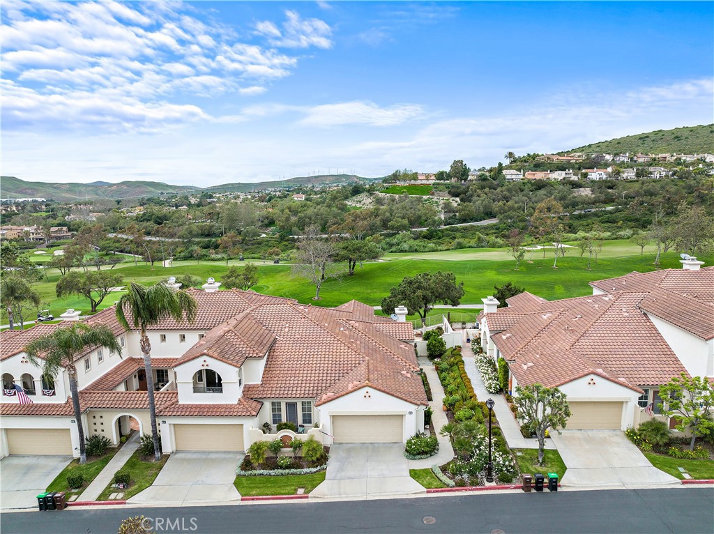 Sweeping views of lush fairways and rolling hills complement the upscale ambiance of this spacious single-level home at Talega’s Carmel neighborhood in San Clemente. The recently upgraded residence shares only one wall with its neighbor and is located close to a resort-style pool and spa. Approximately 2,050 square feet, the three-bedroom, two-bath design is delightfully bright and open, with main living areas flowing to a view-enriched backyard complete with custom stone patios, an awning, and room for a firepit and outdoor living. The living room displays a custom built-in entertainment center and a fireplace, and the dining room generously welcomes memorable gatherings. Kitchen upgrades include all new Viking stainless-steel appliances. Other features include a custom tile backsplash, granite counters, six-burner gas stove, and built-in wine cabinetry. New hardwood floors grace most areas, with designer tile and stone in select living areas. Recessed lighting, ceiling fans, plantation shutters, a spacious central hall and an attached two-car garage are also included. A French door to a private patio invites natural light into the primary suite, where a walk-in closet, dual sinks, stone counters and an oversized shower ensure comfort. Located in the heart of Talega, Carmel makes it easy to enjoy the community’s 18-hole championship golf course, a swim center, beautiful parks and trails, and an array of shopping and dining destinations. Sweeping views of lush fairways and rolling hills complement the upscale ambiance of this spacious single-level home at Talega’s Carmel neighborhood in San Clemente. The recently upgraded residence shares only one wall with its neighbor and is located close to a resort-style pool and spa. Approximately 2,050 square feet, the three-bedroom, two-bath design is delightfully bright and open, with main living areas flowing to a view-enriched backyard complete with custom stone patios, an awning, and room for a firepit and outdoor living. The living room displays a custom built-in entertainment center and a fireplace, and the dining room generously welcomes memorable gatherings. Kitchen upgrades include all new Viking stainless-steel appliances. Other features include a custom tile backsplash, granite counters, six-burner gas stove, and built-in wine cabinetry. New hardwood floors grace most areas, with designer tile and stone in select living areas. Recessed lighting, ceiling fans, plantation shutters, a spacious central hall and an attached two-car garage are also included. A French door to a private patio invites natural light into the primary suite, where a walk-in closet, dual sinks, stone counters and an oversized shower ensure comfort. Located in the heart of Talega, Carmel makes it easy to enjoy the community’s 18-hole championship golf course, a swim center, beautiful parks and trails, and an array of shopping and dining destinations.