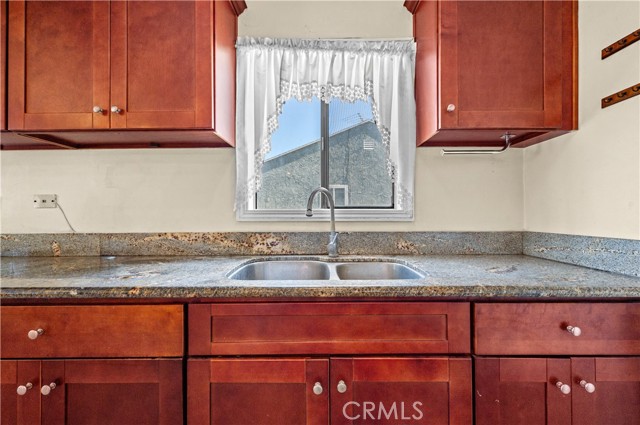 Who wouldn't enjoy doing dishes in this lovely remodeled kitchen?