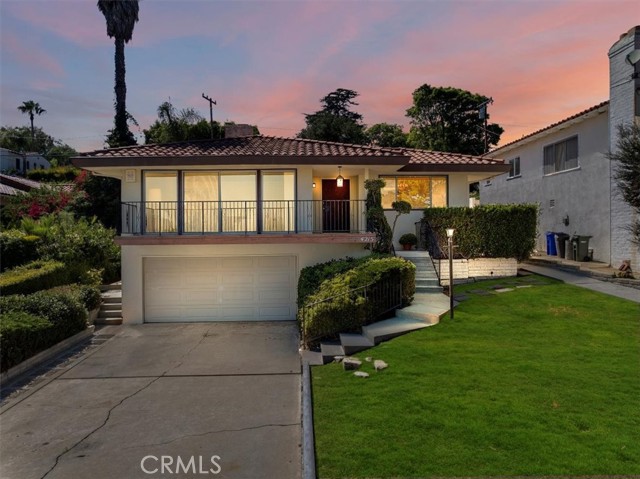 Front of home at sunset. Grass has been digitally enhanced.