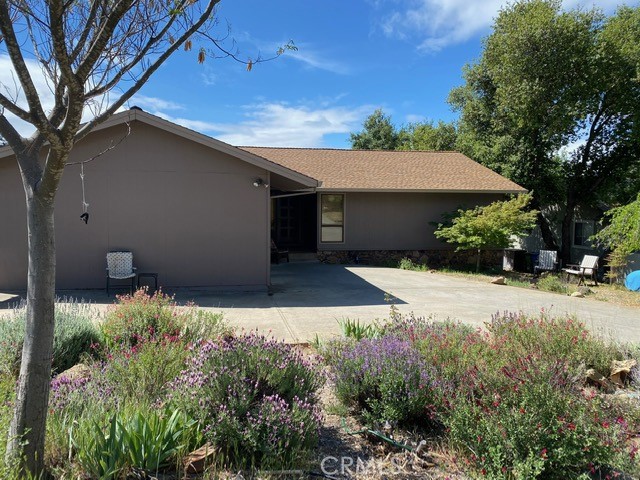 16747 Greenridge Road Hidden Valley Lake, California Affordable! This 3 bed / 2 bath home has 1,433 SF located in beautiful Hidden Valley Lake. Enter the home to find a nice open floorplan with vaulted/wood beam ceilings providing a spacious feel. The living room has a stately wood burning fireplace and a sliding glass door that leads to a covered back deck- great for outdoor enjoyment! Drought tolerant landscaping front and back + a fully fenced backyard is a bonus! Kitchen includes decorative built in shelving unit, newer electric range & microwave, a large storage pantry and an adorable coffee bar with trash compactor! Enjoy dining at the breakfast bar, dining nook or room for formal dining in the living room. Brand new sliding glass door with small wood deck & landing for easy backyard access! 3 comfortably sized bedrooms and a hall bath with tiled flooring & countertops. The master has access to a private covered deck and separate sunroom with it's own closet/built in drawers. The master bath includes a 2nd closet with built in drawers, tiled flooring & countertop. New interior/exterior paint, newer roof & recently pumped septic system! Located around the corner from Raven Hill Park and the Conestoga Hiking Trail, this home has it all!