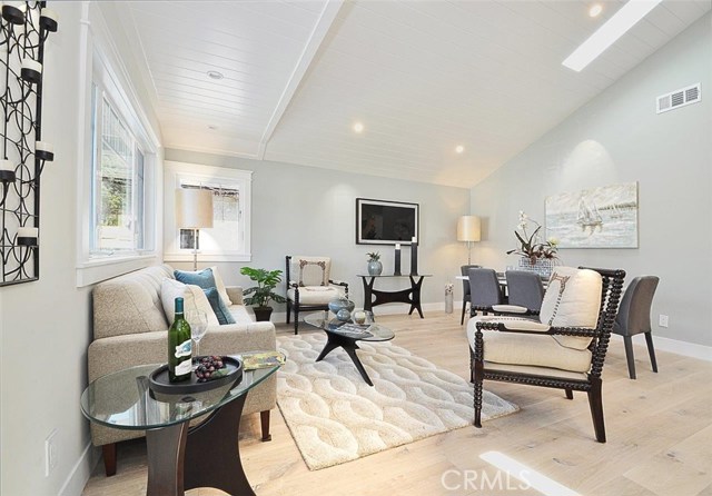 Living room with vaulted ceiling and skylights!