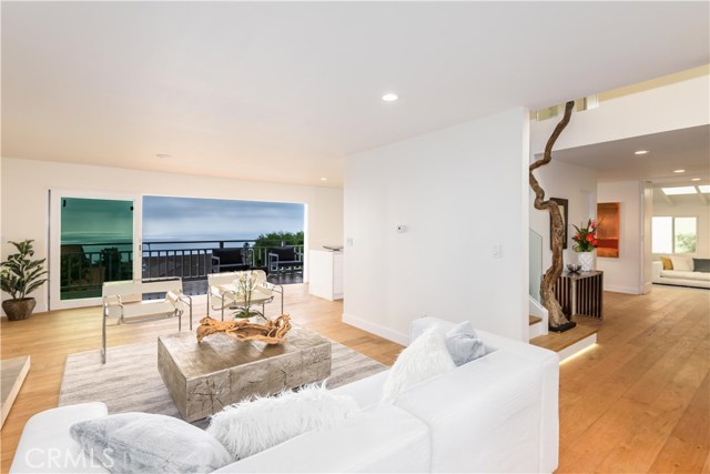 30734 Rue De La Pierre Rancho Palos Verdes, California Breathtaking Panoramic Ocean-View Designer House with Minimalism Style! Plus excellent location - steps to the award winning Pt. Vicente Elementary School, close to golden cove shopping center with fabulous ocean view restaurants. Making this spectacular remodeled home a once in a lifetime opportunity not to be missed! Re-wired and re-piped throughout!
Upon entering, you will immediately fall in love with the high ceiling foyer, the artistic use of stone, glass, wood, fabulous light. The next generation kitchen features European Style cabinet, high-end Appliances, waterfall island with Quartzite Counters and much more to impress the most discerning chef. Ocean view Kitchen, living room, dining room and bar area connects a large view deck with wide folding glass door, offering the best of indoor-outdoor living.
The designer touch floor plan was carefully thought and made good use of every square feet. Main level library ‘s private bathroom is distinguished by ocean view bathtub. This main level room can also be used as a in-law suite. The luxurious ocean view second level master bedroom suite & other 2 more bedrooms connect to top level large deck overlooking the ocean. The fourth bedroom upstairs can also enjoy ocean view.
Lush picturesque landscaping in front and back of home and three car garage with tremendous storage set off the luxury modern home. Must see to appreciate !
