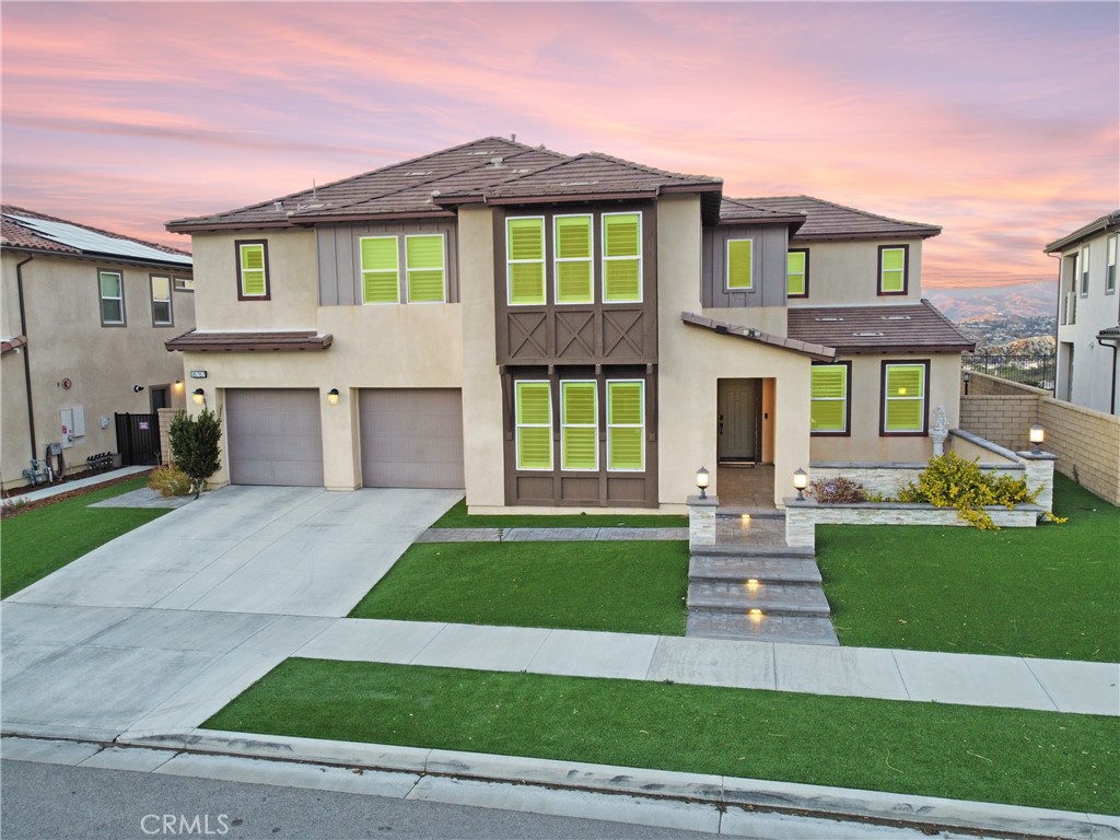 Gorgeous VIEW HOME in the safe gated community of Aliento !!! The spacious open floor plan has 4,023 square feet of luxury living. It has a bedroom with a full bath downstairs plus a bonus room also downstairs which is currently used as an office adjacent to the laundry room. Has a PAID OFF solar panel system. The living room opens to the huge Chef Style Gourmet kitchen which is complete with an over sized island. Granite counter tops, stainless steel appliances, gas burners, double ovens/convection, pantry, and soft close cabinetry! Pride of ownership with attention to detail. The wide staircase leads upstairs to an oversized loft area. The primary suite is on one side with 3 additional bedrooms on the other. The primary suite has tremendous views, over sized bathroom with free standing tub, walk-in shower, dual vanities and a walk-in closet. This property is located in a quiet, friendly community which has a community clubhouse complete with a huge pool for adults and small pool for kids, gym, SPA, Clubhouse, dog park, private park and much more! Minutes away from shops like Trader Joes and Costco, restaurants, public parks and hiking trails. It's an entertainers delight and this community is the PERFECT place for your family. This property has a yearly mello roos tax of $4,119. Don't miss your opportunity to own this stunning home in one of the most desirable neighborhoods in Santa Clarita.