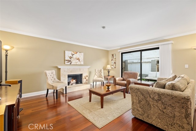 Beautiful wood flooring, cozy family room downstairs, fireplace with sliding doors to the private backyard and patio