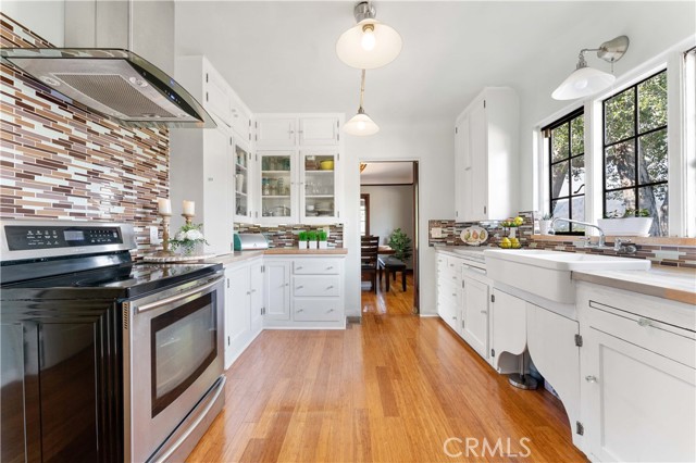 Bright kitchen with stainless steel appliances.