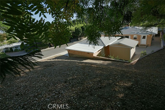 View of property and Villena Avenue from southwest corner of back yard