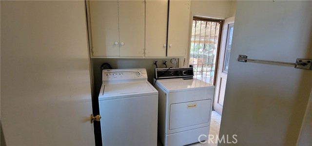 Laundry room with clothes washer and dryer.