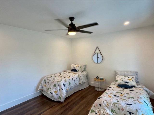 Upstairs Bedroom with access to balcony, Ceiling Fan, Recessed lights.