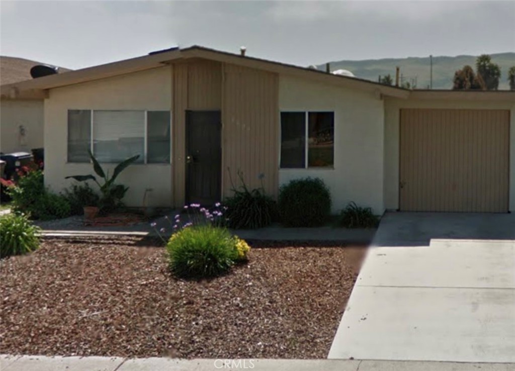 4822 Sanchez Drive Guadalupe, California Affordable living on the Central Coast! Loads of potential with this 2 bedroom, 1 bath twin home in a great Guadalupe neighborhood. Comfortable and functional floor plan with kitchen, living room and attached single car garage. Newer furnace and water heater, low maintenance landscaping and fully fenced backyard. Great investment opportunity! Don’t miss this one. Priced at $325,000.