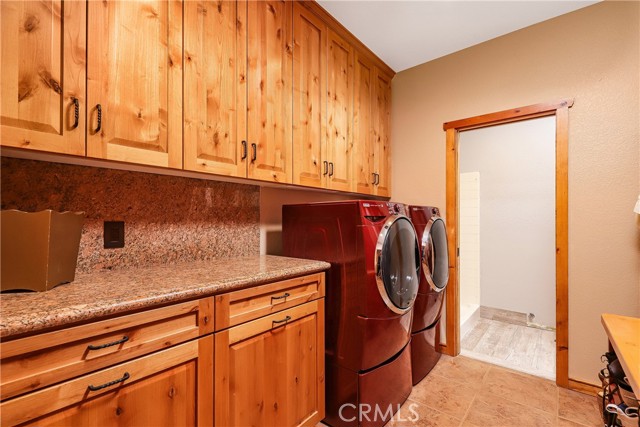 Laundry room with access to3/4 bath and garage