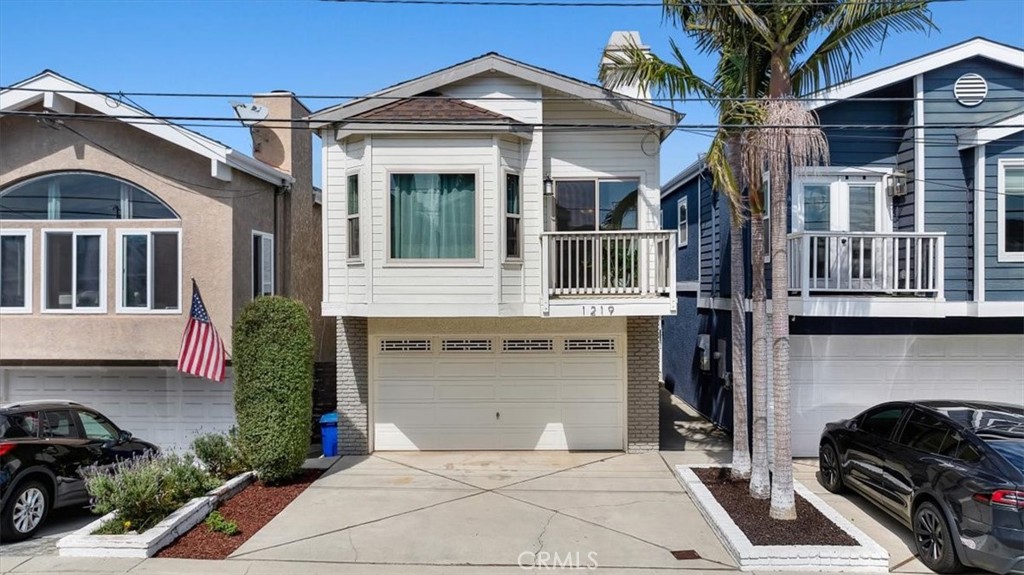 When you arrive at 1219 20th, all of the stresses of everyday life disappear! This warm and sophisticated home features 3 bedrooms, 2.5 bathrooms, and approximately 2,124 square feet of living space and a rooftop deck.  The upstairs open floor plan connects the large kitchen to the dining and living rooms, making the upstairs space ideal for dining and entertaining. The tall ceilings and skylights fill the home with natural light further accentuating the generous living room space featuring an amazing fireplace as the room's centerpiece. The primary bedroom embodies a private resort-like feel with a large living space and a separate dedicated fireplace, a walk-in closet, and a luxurious bathroom appointed with a separate shower and bathtub as well as dual sinks. Off the primary bedroom is a large private outdoor deck facing a lush natural fence, which leads to a charming and sizable rooftop deck with views. The downstairs offers a beautifully remodeled bathroom and 2 large bedrooms, one of which leads out to a generous backyard boasting turf grass ideal for additional entertaining and play area for kids and pets. The garage space has been smartly converted into a divided area of both a spacious bonus family room, not included in the total square footage, and an accessible storage space for bikes and other outdoor accessories. Located roughly two blocks from both the award-winning Hermosa View Elementary School and Mira Costa High School, and walkable distances to both Hermosa Vista and Hermosa Valley schools, this home offers all of what makes Hermosa Beach such a special community.