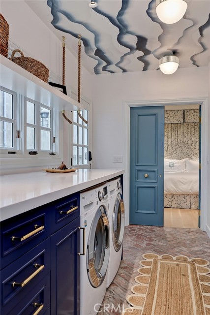 Laundry room looking to primary suite