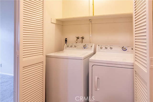 Washer Dryer closet includes wsher & dryer